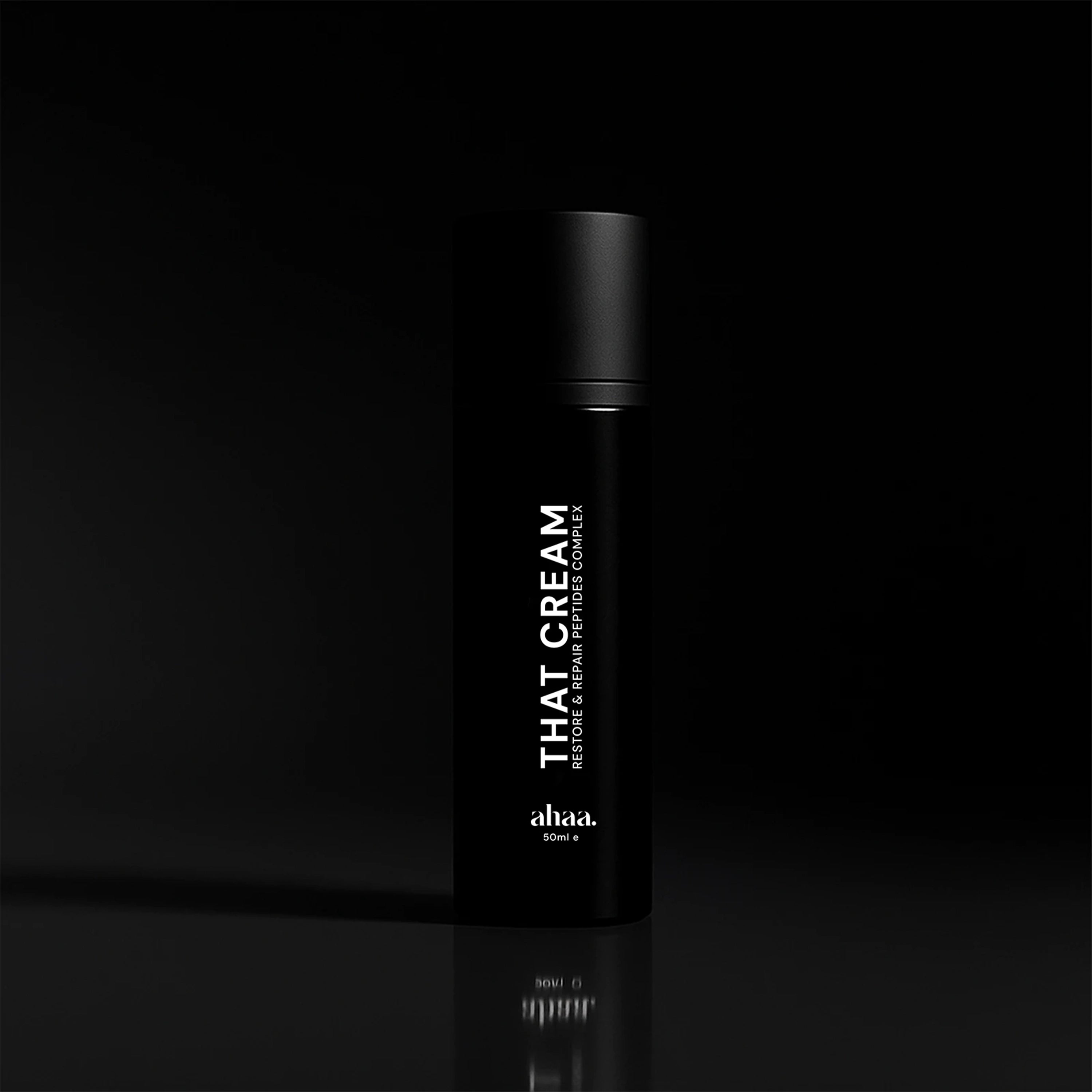Black bottle of 'THAT CREAM' with peptides and vitamins by ahaa on a black background